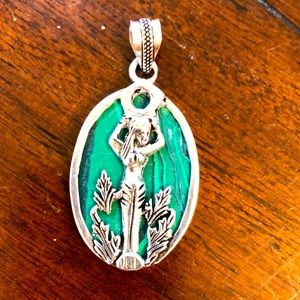 New, never worn. Silver plated fashion pendant with mermaid and stone